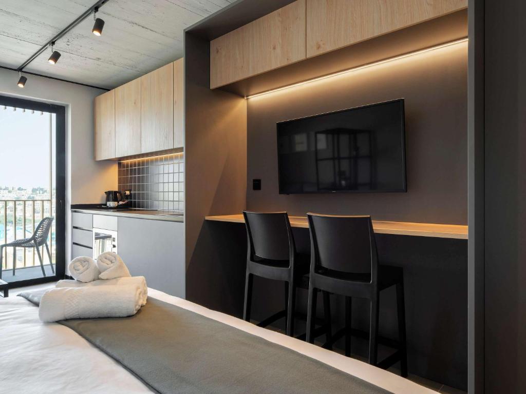 Kuchyň nebo kuchyňský kout v ubytování Aparthotel Adagio Malta Central