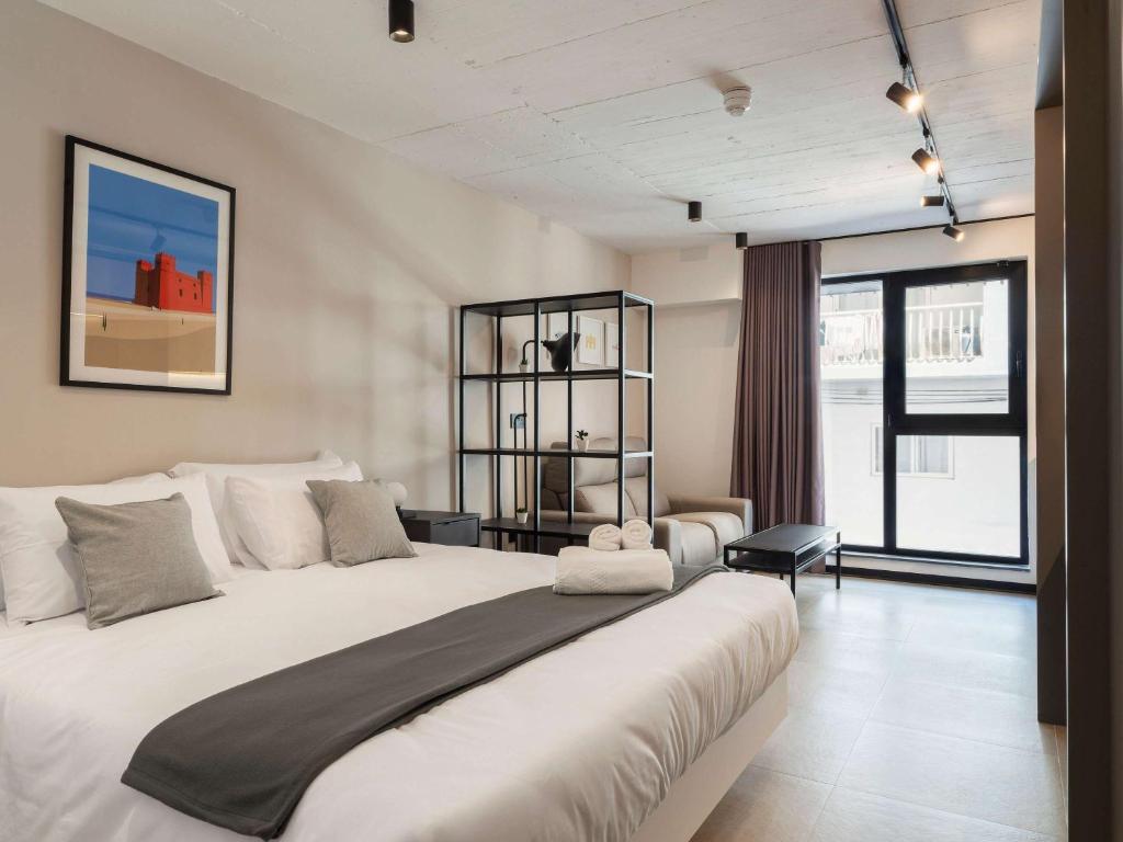 Postel nebo postele na pokoji v ubytování Aparthotel Adagio Malta Central