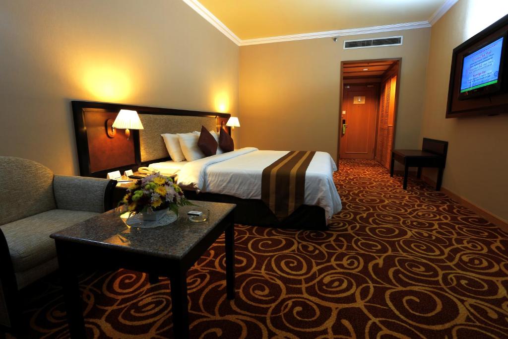 Mega Hotel Sdn Bhdにあるベッド