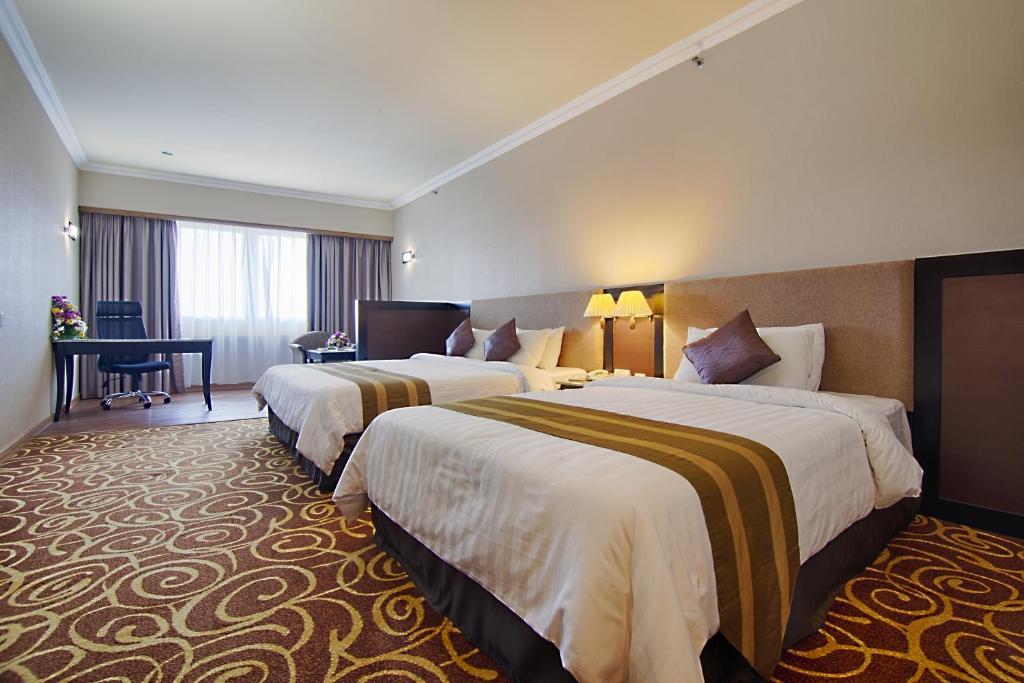 Mega Hotel Sdn Bhdにあるベッド