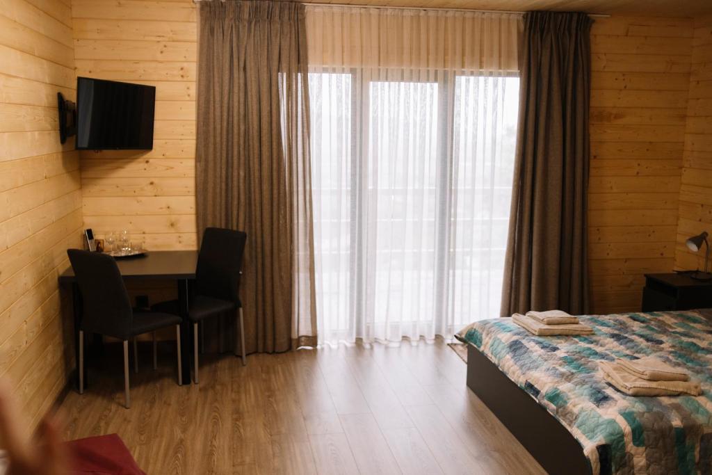 Postel nebo postele na pokoji v ubytování Готель Logindariy