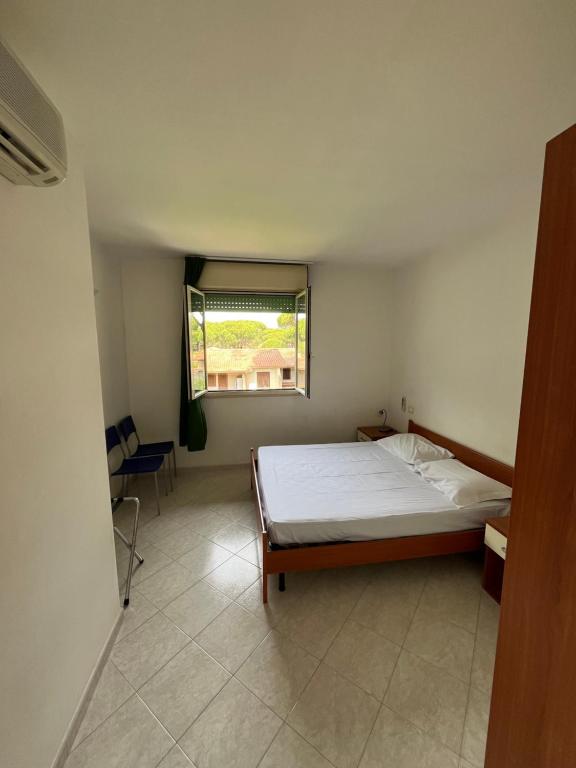 Postel nebo postele na pokoji v ubytování Residence Verde Pineta