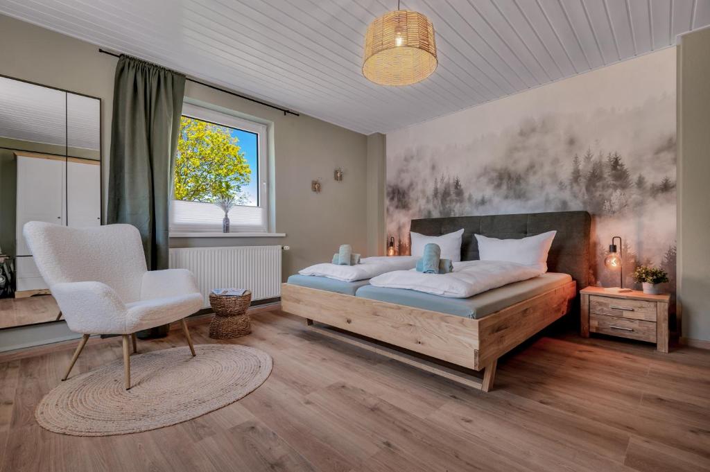 Postel nebo postele na pokoji v ubytování Gruppen & Familien-Ferienhaus Hänsel