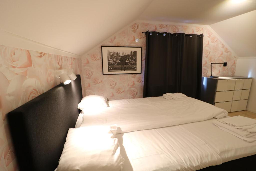 Postel nebo postele na pokoji v ubytování RIBO Apartment Arctic