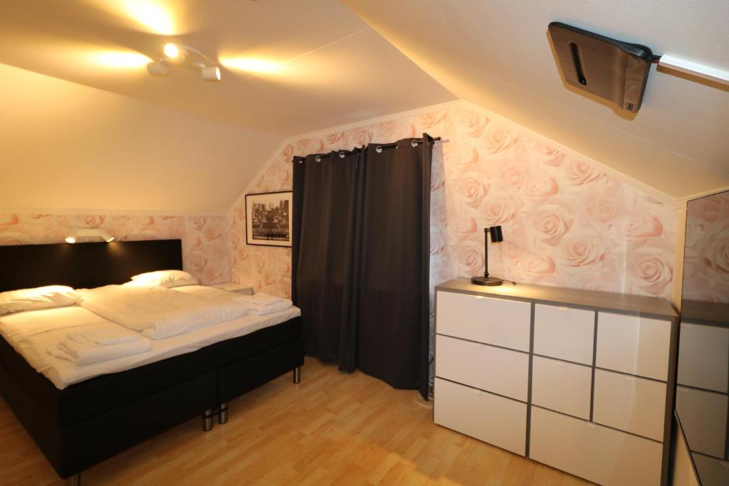 Postel nebo postele na pokoji v ubytování RIBO Apartment Arctic