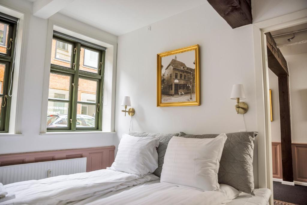 Postel nebo postele na pokoji v ubytování Hotel Hamlet