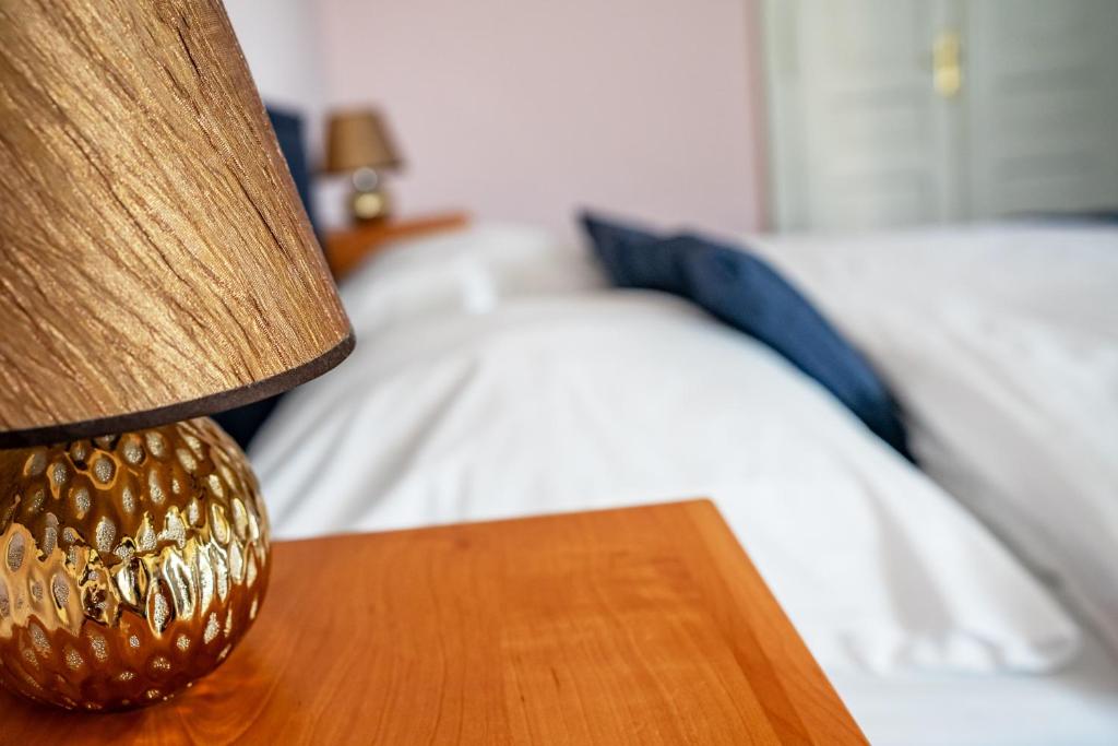 Postel nebo postele na pokoji v ubytování Hotel Růžek
