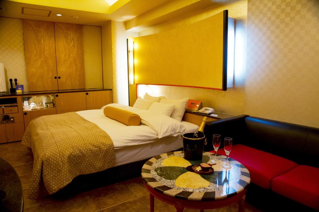 Postel nebo postele na pokoji v ubytování Hotel Grand Garden (Adult Only)