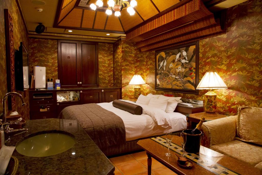 Postel nebo postele na pokoji v ubytování Hotel Grand Garden (Adult Only)