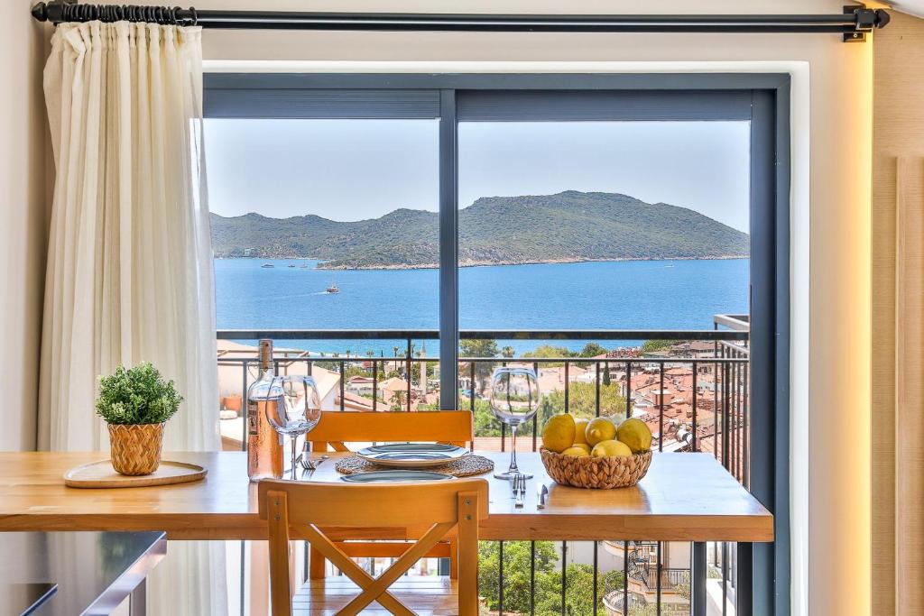 a dining room table with a view of the ocean at Sole Suites in Kas