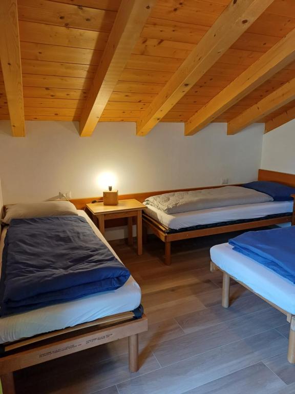Postel nebo postele na pokoji v ubytování Casa Bresadola - Pellizzano