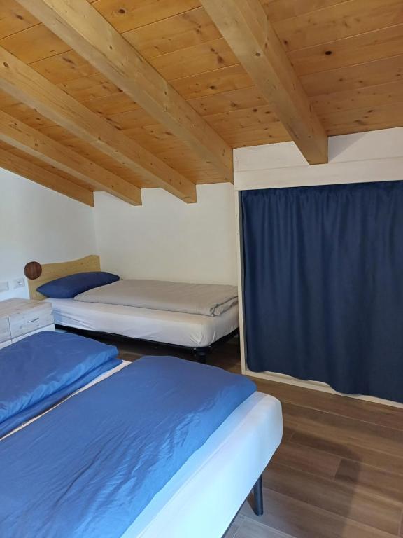 Postel nebo postele na pokoji v ubytování Casa Bresadola - Pellizzano