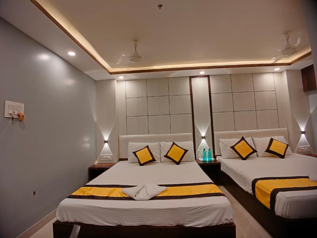 Postel nebo postele na pokoji v ubytování HOTEL RINKY'S PALACE