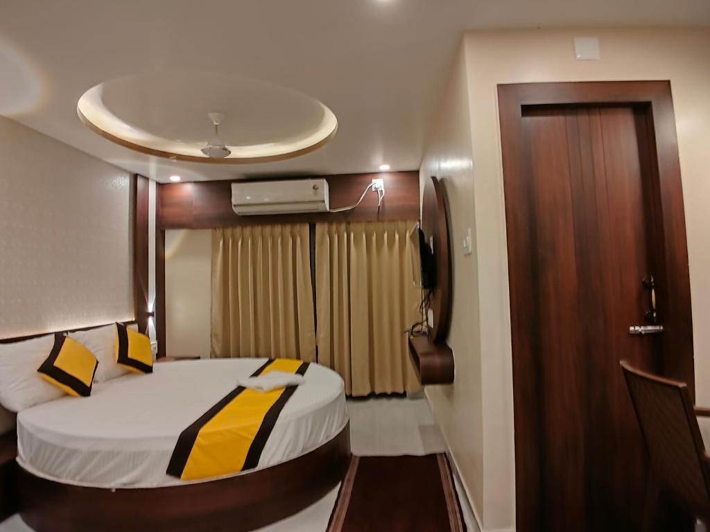Postel nebo postele na pokoji v ubytování HOTEL RINKY'S PALACE