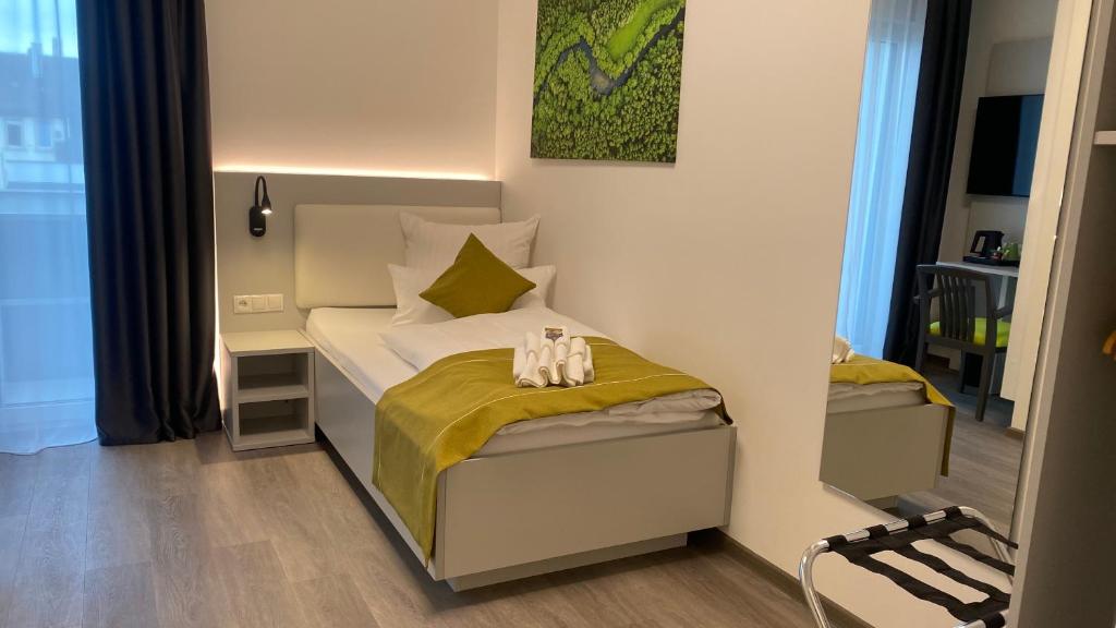 Postel nebo postele na pokoji v ubytování GuestHouse Große Linde