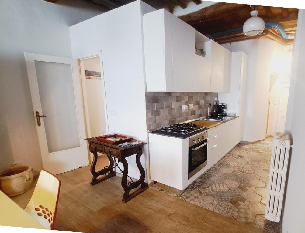 A kitchen or kitchenette at La Scalinata Apartment