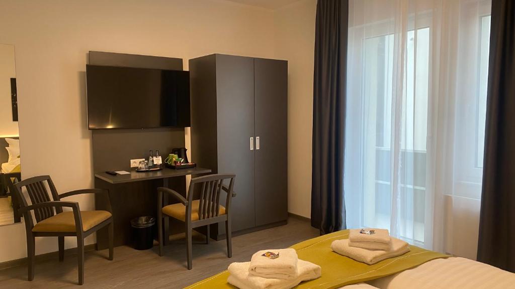 Postel nebo postele na pokoji v ubytování GuestHouse Große Linde
