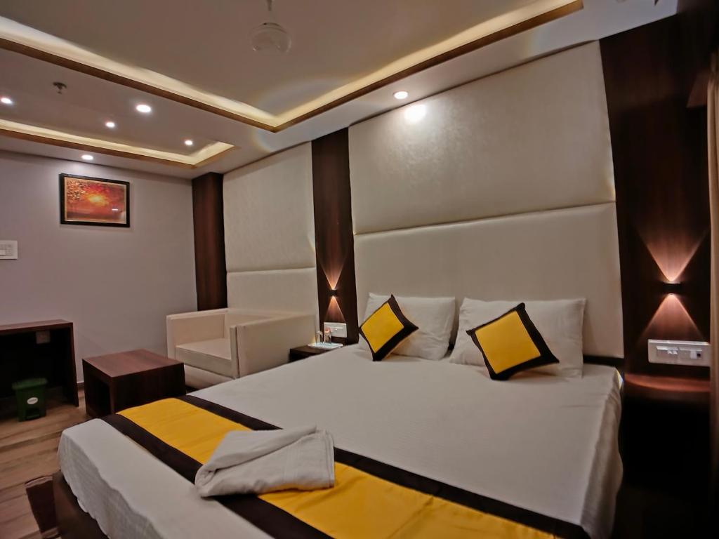 Postel nebo postele na pokoji v ubytování HOTEL RINKY'S PALACE
