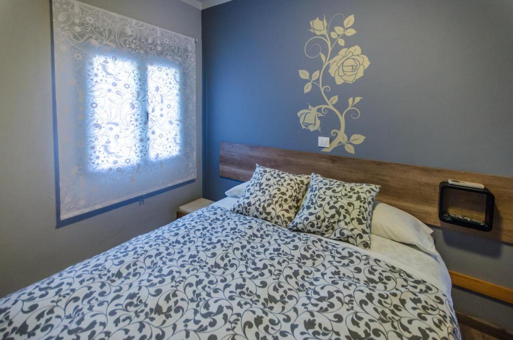 Posteľ alebo postele v izbe v ubytovaní Hostal La Pastora