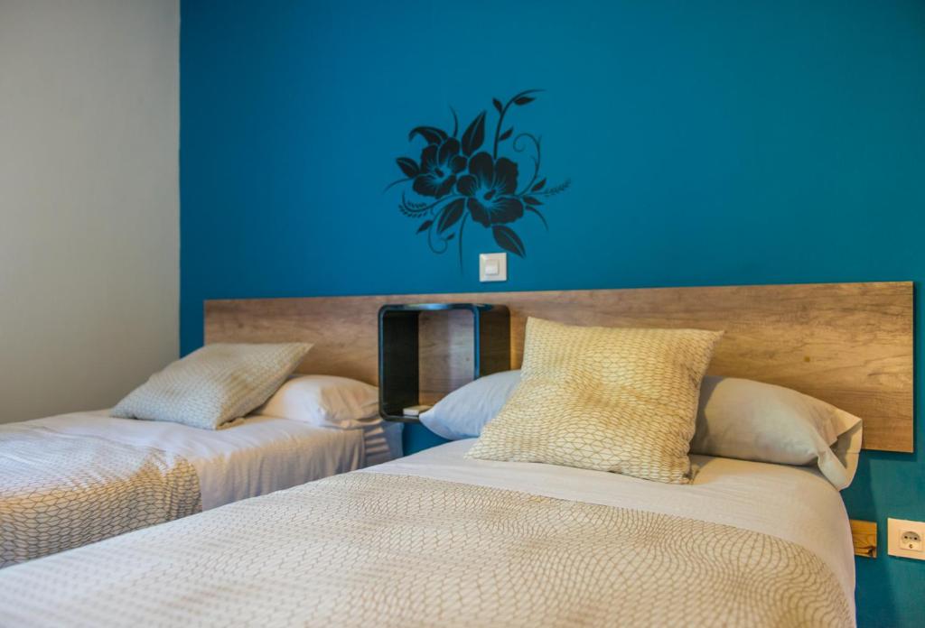 Posteľ alebo postele v izbe v ubytovaní Hostal La Pastora