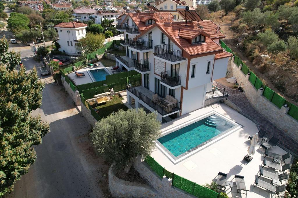 an aerial view of a house with a swimming pool at Villa Bağ Tepesi in Fethiye