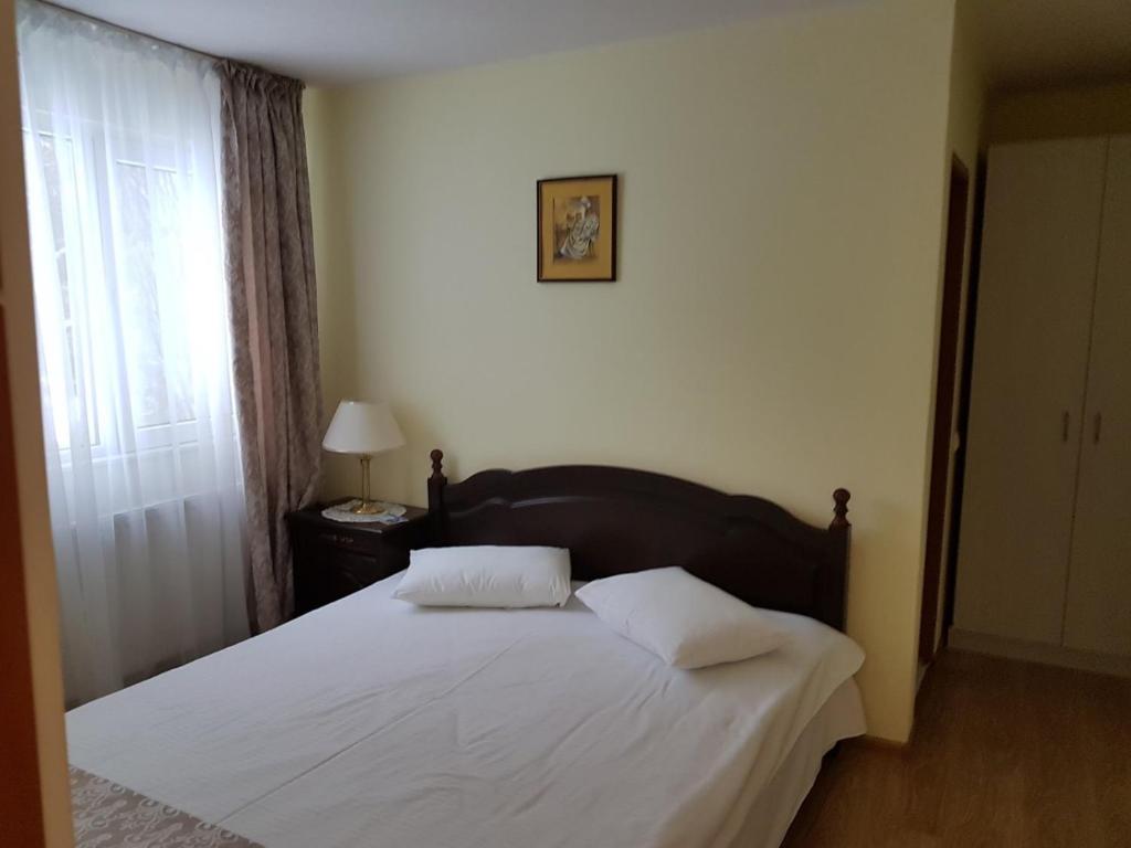 Postel nebo postele na pokoji v ubytování Vila Felix