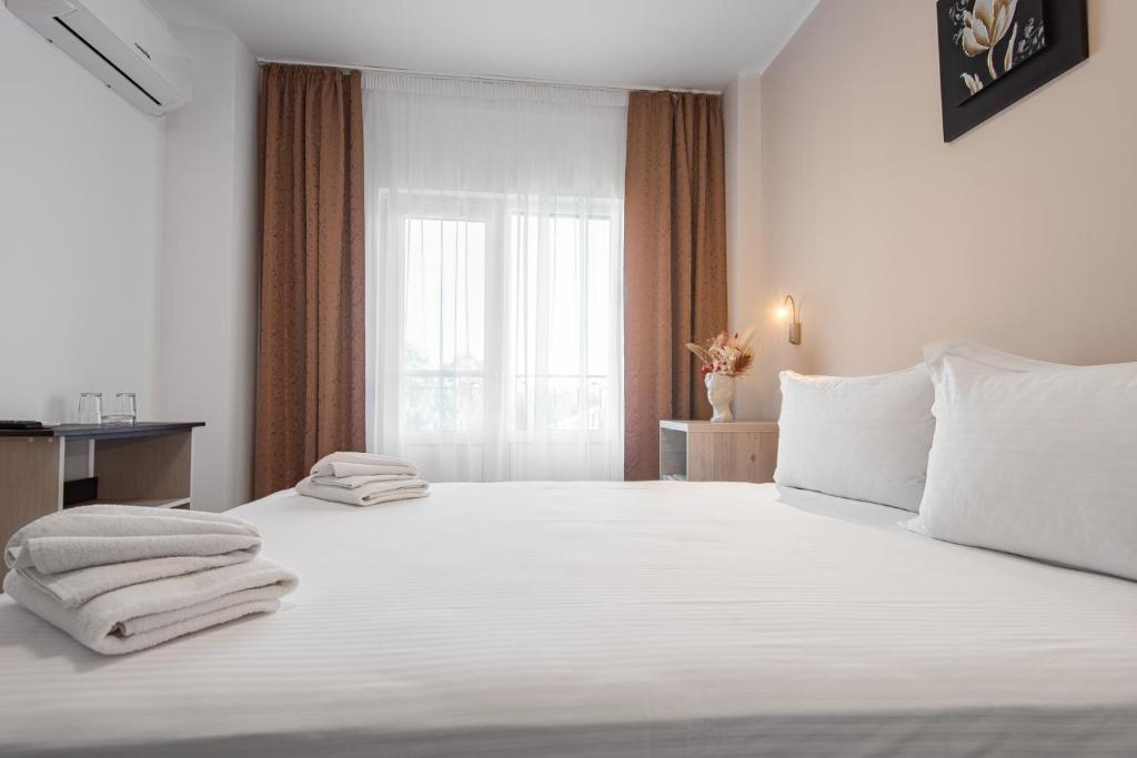Postel nebo postele na pokoji v ubytování Casa Polux