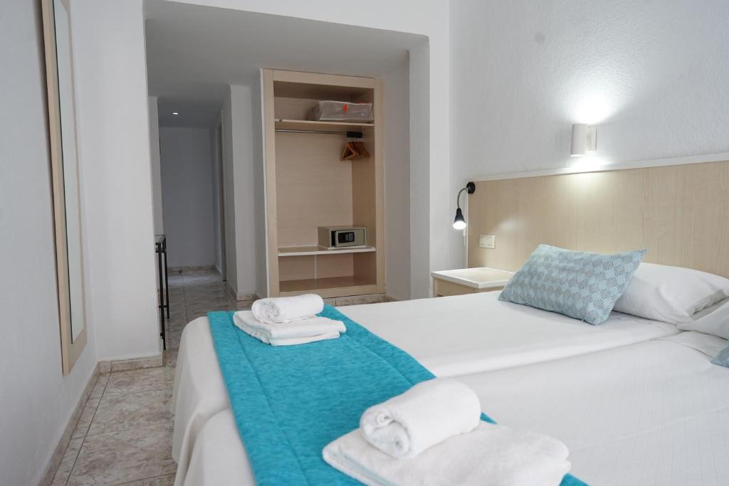 Postel nebo postele na pokoji v ubytování Hotel Teide