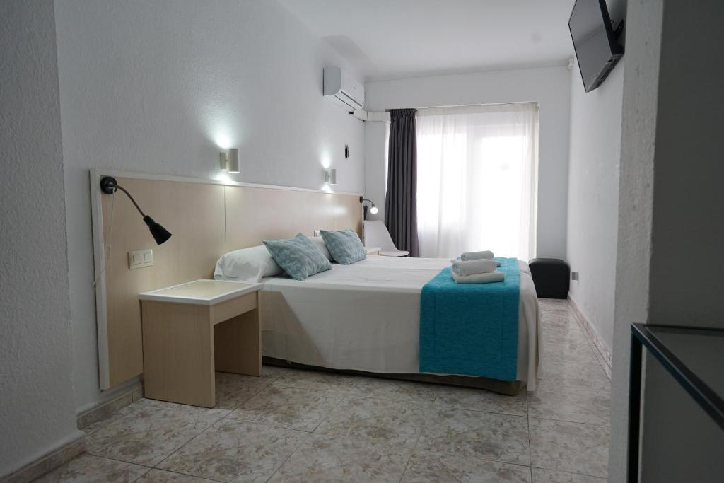 Postel nebo postele na pokoji v ubytování Hotel Teide