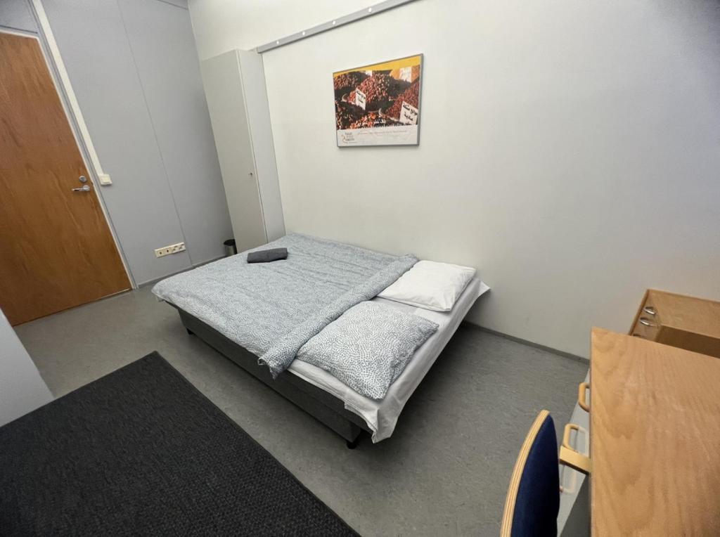 Postel nebo postele na pokoji v ubytování Office House Services 207