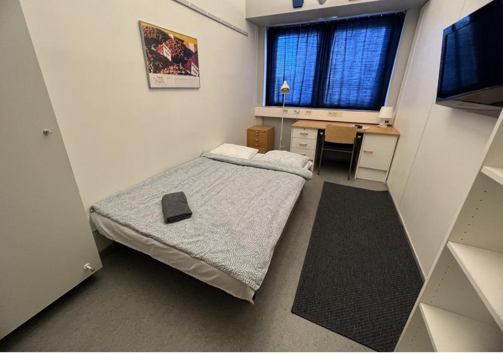 Postel nebo postele na pokoji v ubytování Office House Services 207
