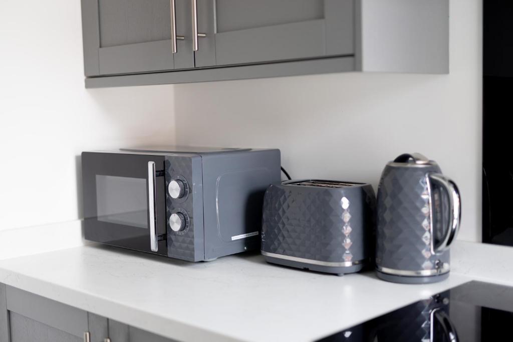 Kuchyň nebo kuchyňský kout v ubytování Victoria Apartments