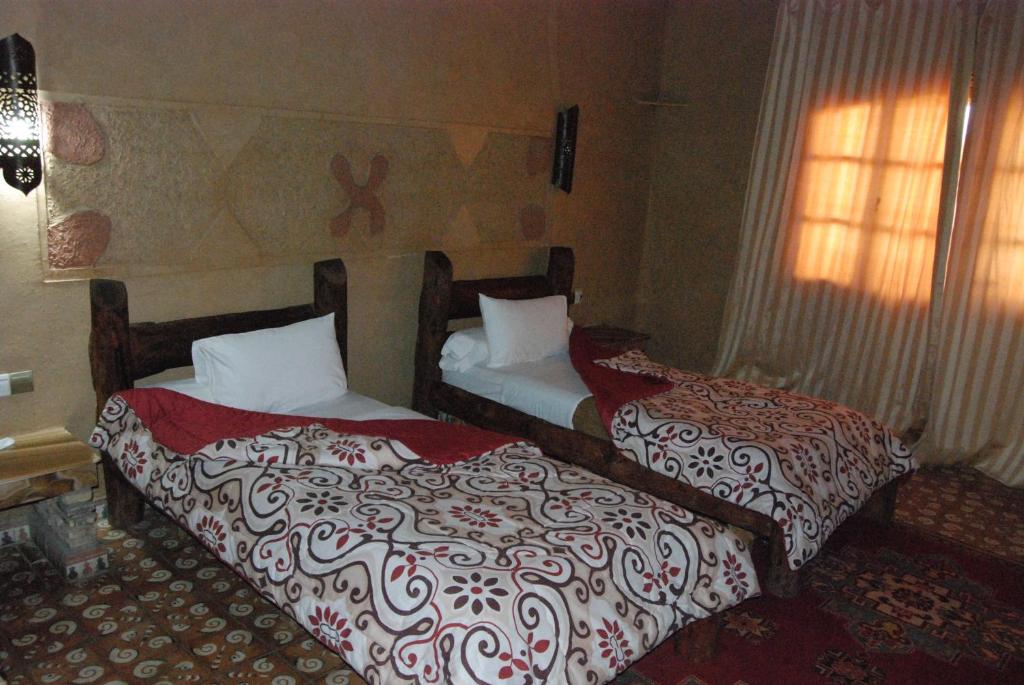 Postel nebo postele na pokoji v ubytování Hotel Taddart