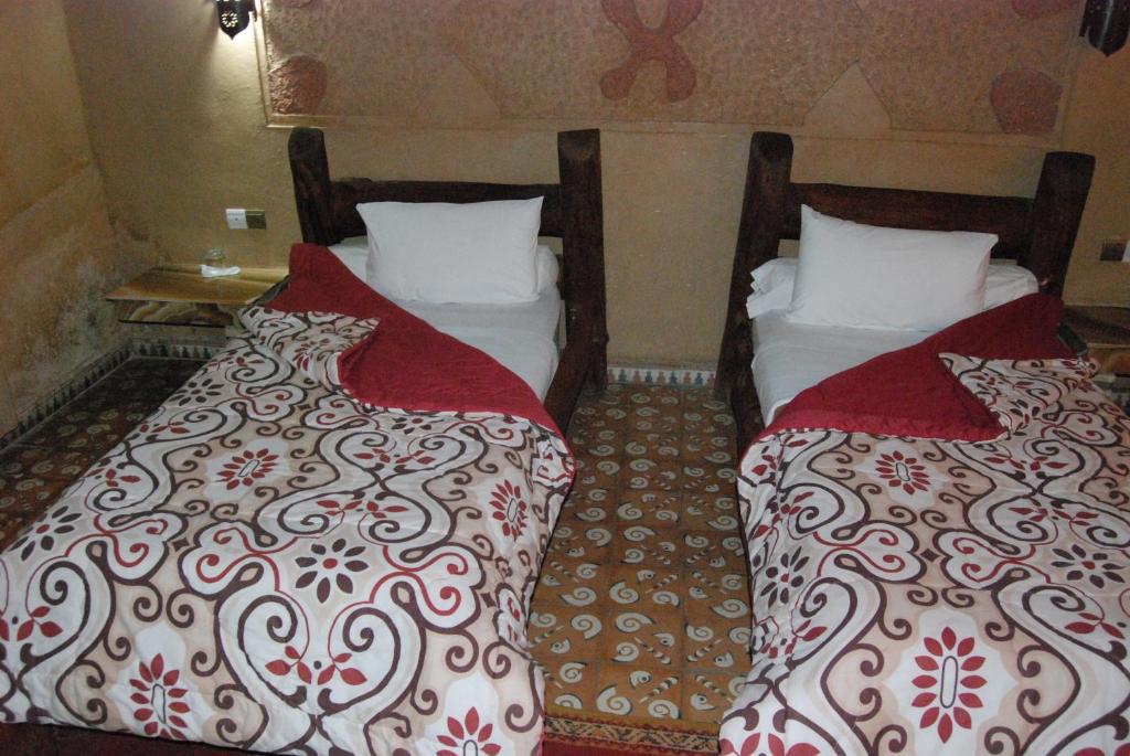 Postel nebo postele na pokoji v ubytování Hotel Taddart