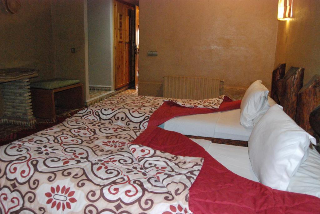 Postel nebo postele na pokoji v ubytování Hotel Taddart