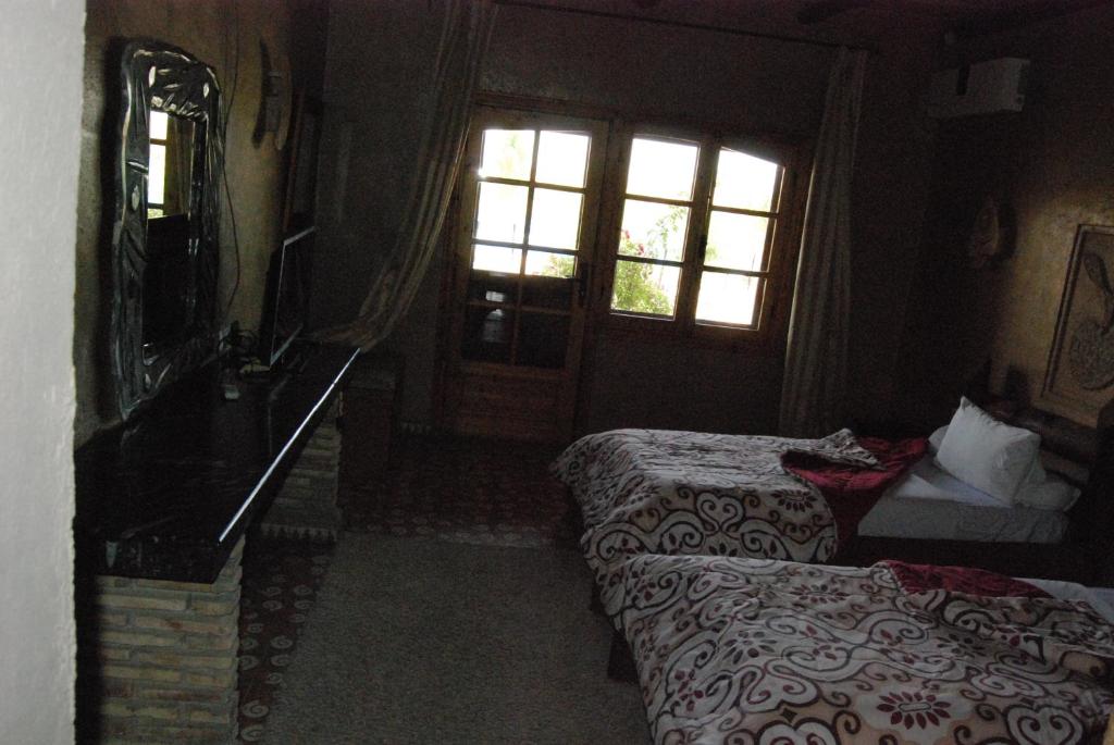 Postel nebo postele na pokoji v ubytování Hotel Taddart