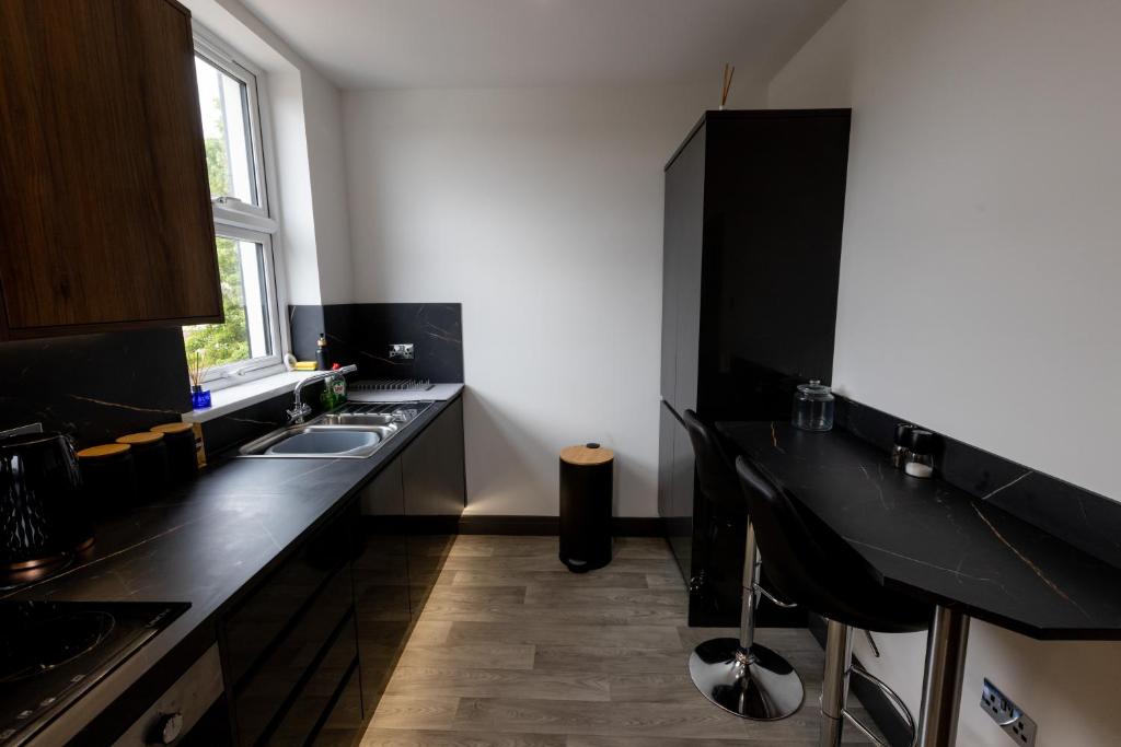 Kuchyň nebo kuchyňský kout v ubytování Victoria Apartments
