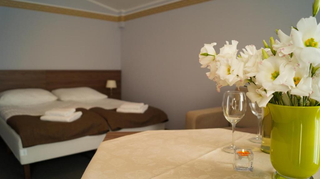 Postel nebo postele na pokoji v ubytování Hotel Zorza