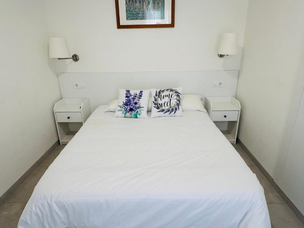 Postel nebo postele na pokoji v ubytování Apartamentos Turísticos Victoria