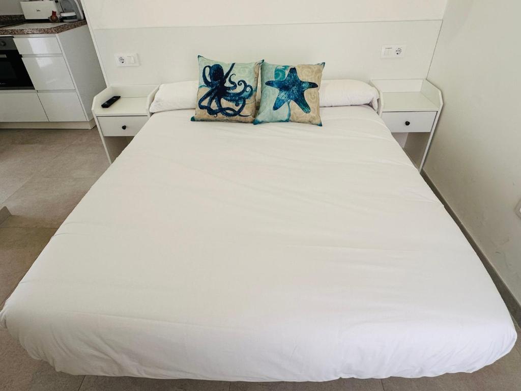 Postel nebo postele na pokoji v ubytování Apartamentos Turísticos Victoria