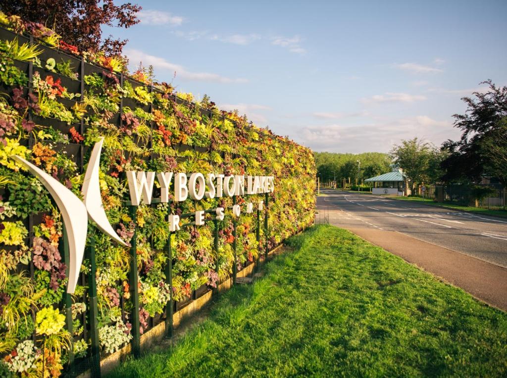 a wall of flowers on the side of a road at The Waterfront Hotel Spa & Golf in Saint Neots