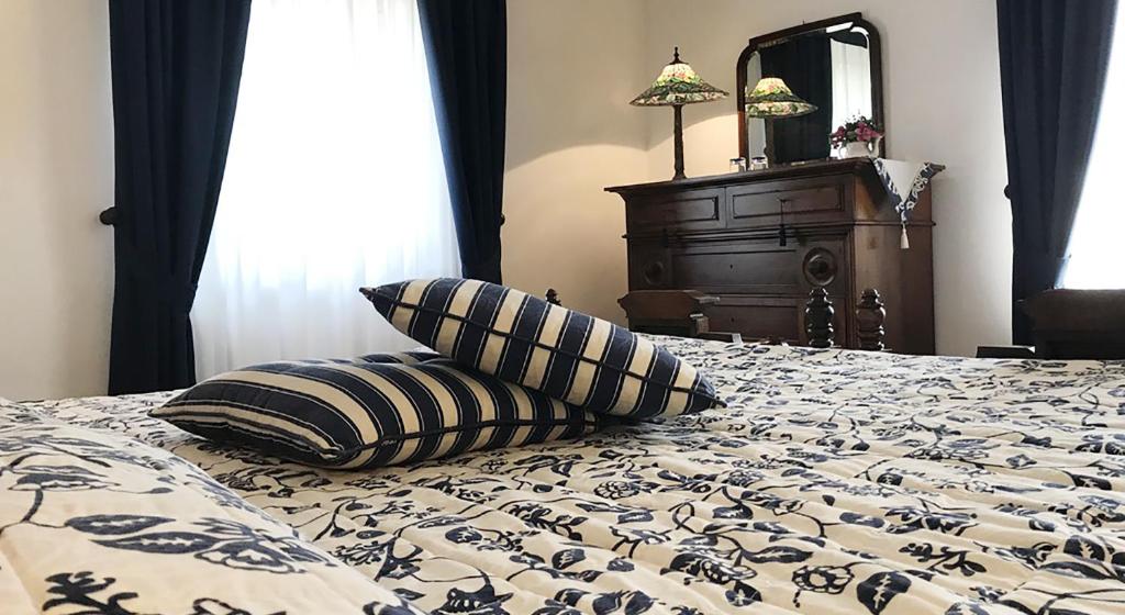 Postel nebo postele na pokoji v ubytování Casa Due Tigli B&B