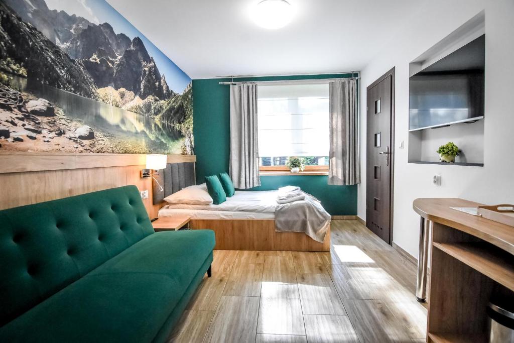 Posteľ alebo postele v izbe v ubytovaní Apartamenty Mrozówka