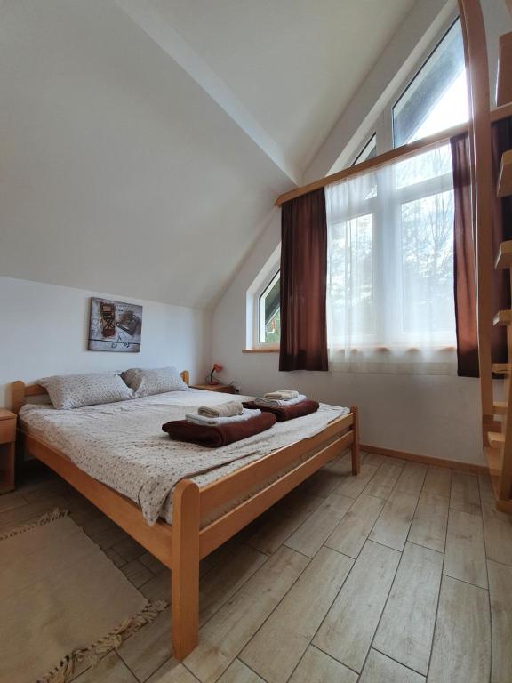 Postel nebo postele na pokoji v ubytování Apartmani Milutinovic