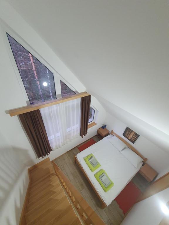 Postel nebo postele na pokoji v ubytování Apartmani Milutinovic