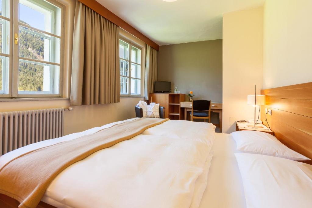 Posteľ alebo postele v izbe v ubytovaní Hotel Tre Cime Sesto - Sexten
