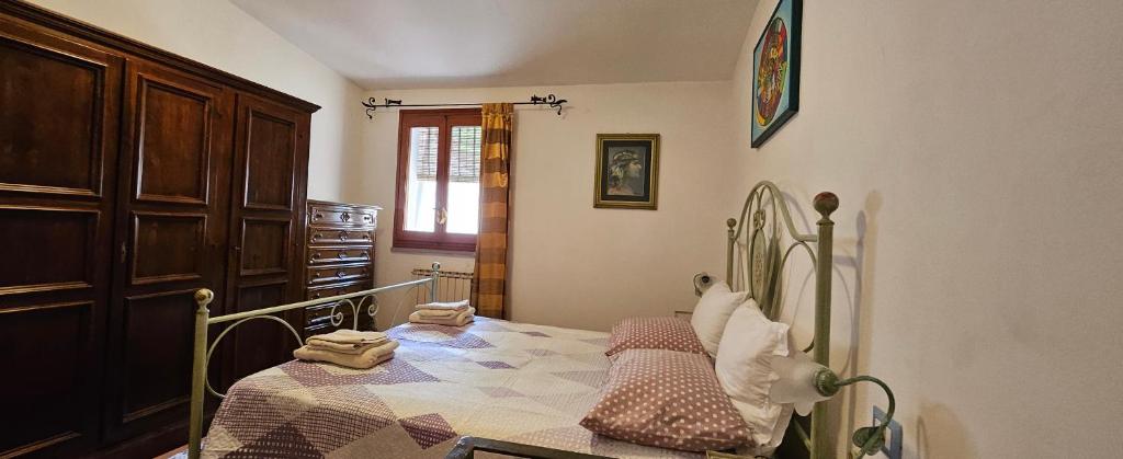 Postel nebo postele na pokoji v ubytování "A Ridosso" sul mare nel cuore del paese