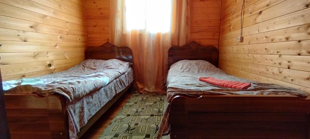 Postel nebo postele na pokoji v ubytování Vila Latphari in Ushguli
