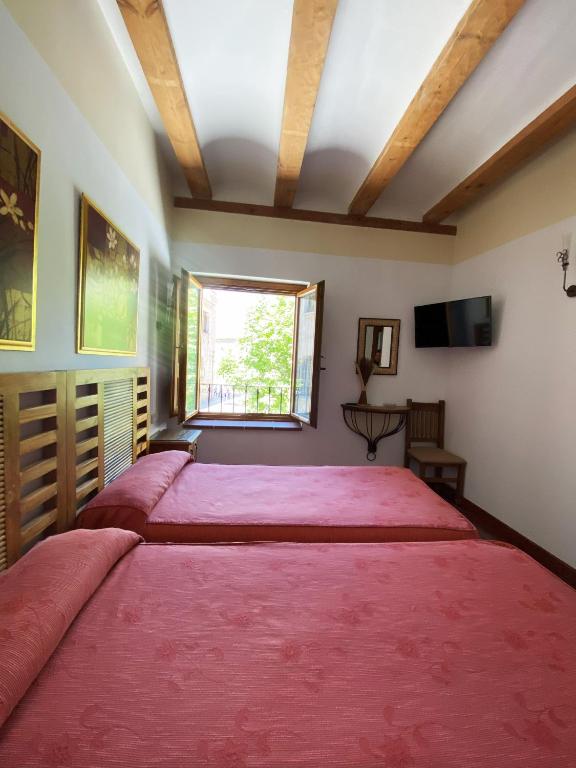 Postel nebo postele na pokoji v ubytování HOTEL EL RASTRO - Palacio Duque de Tamames -