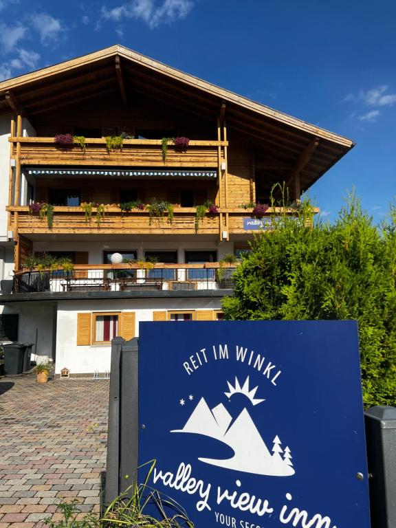 a sign in front of a building at REIT IM WINKL - ValleyViewInn in Reit im Winkl